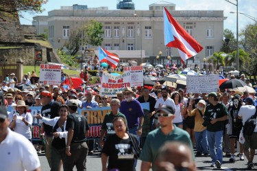 I manifestanti hanno marciato dal Campidoglio fino alla Fortaleza. Sullo sfondo la Casa Olimpica, sede del Comitato Olimpico nazionale