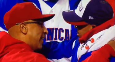 Edwin Rodríguez and Tony Peña, captains of the Puerto Rico and Dominican Republic teams, respectively, greet each other after the Dominican Republic's victory.